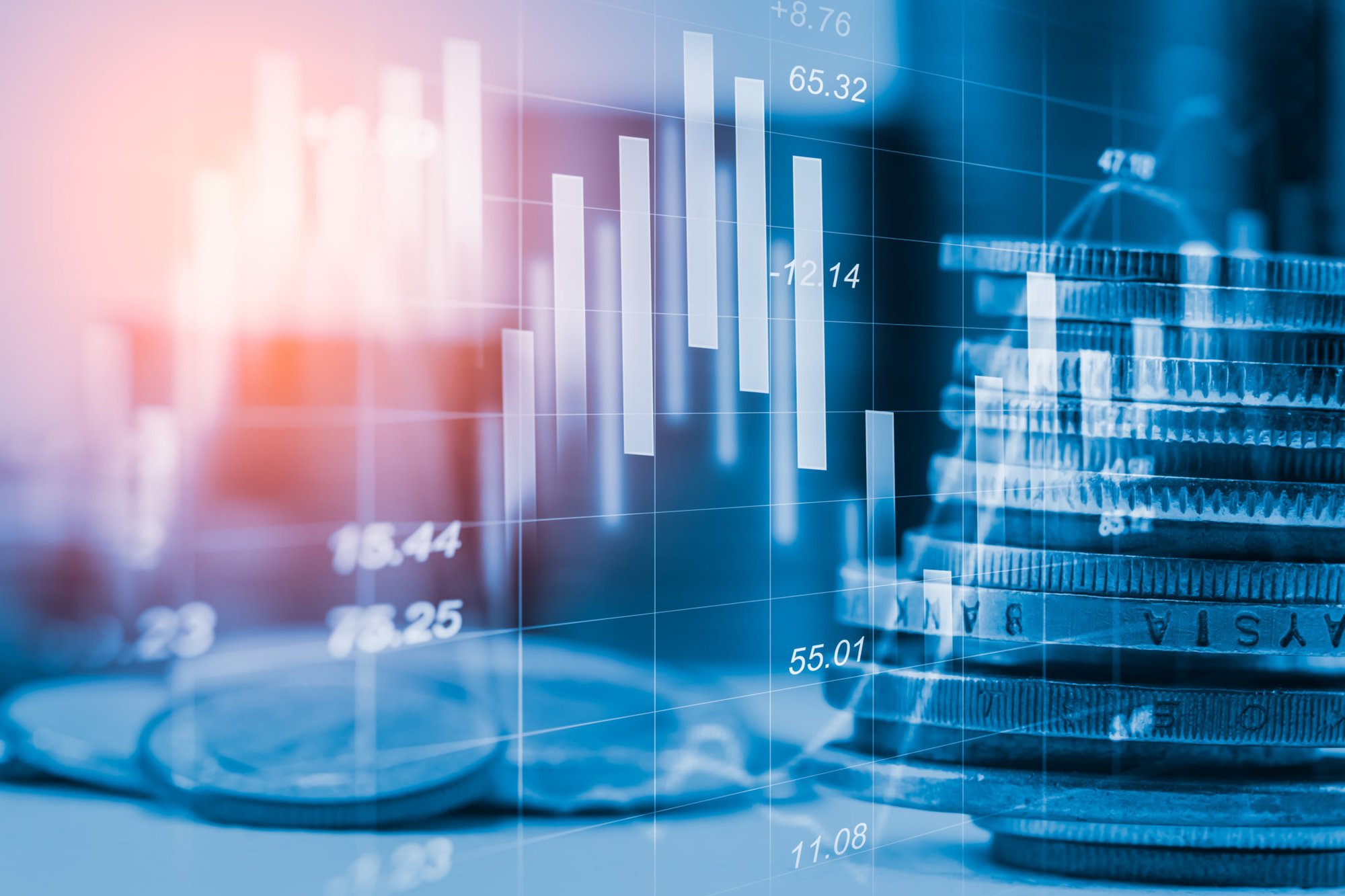 coins stacked on a table with financial chart concept overlay