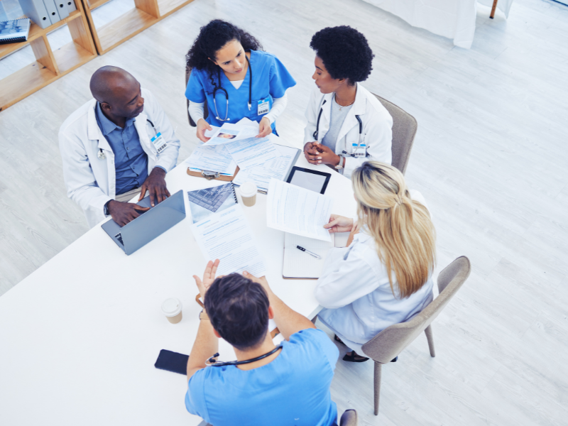Top view of a group of doctors meeting in a conference room
