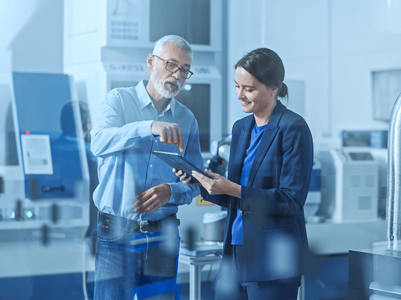 Male Project Manager Standing in High Tech Development Facility