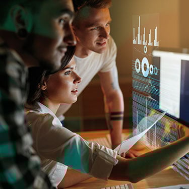 Programmers Working On Software In Office