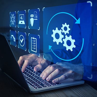 man using technology on a laptop to automate business tasks with AI
