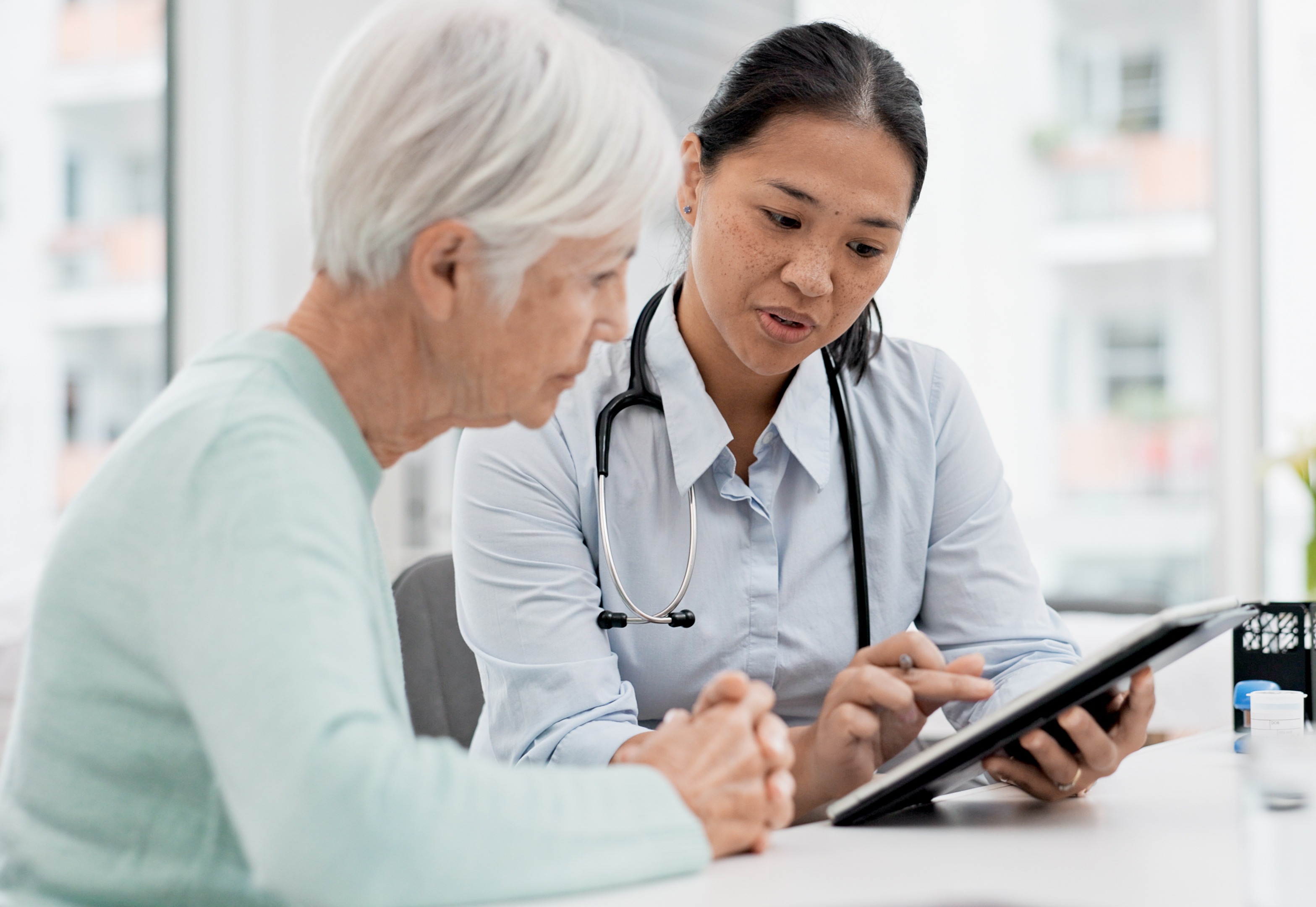 Doctor helping patient